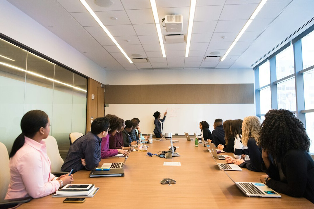 manager leading team meeting